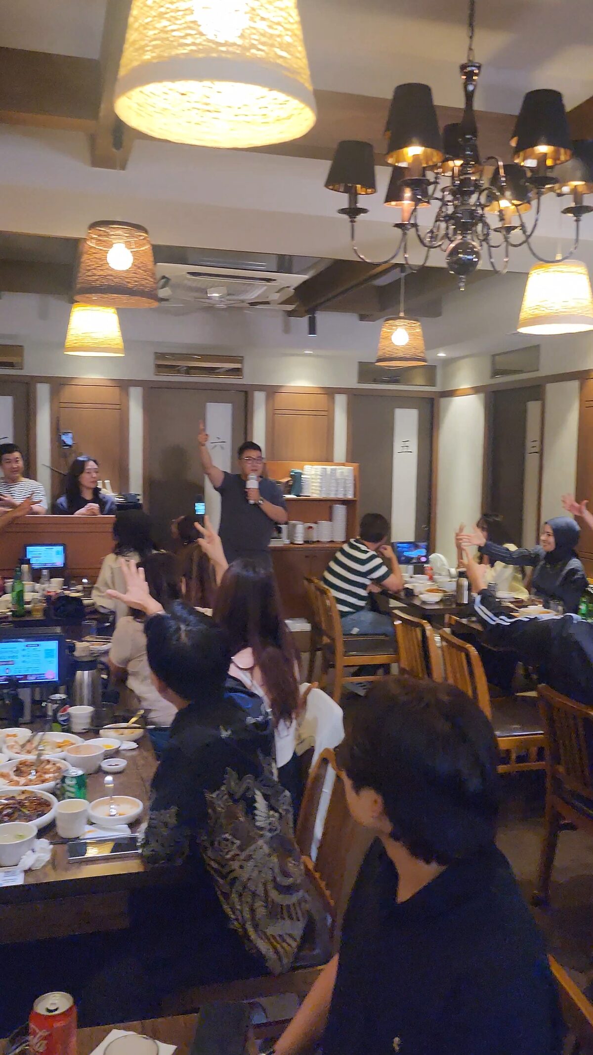 The Mukstar Party host leading a recreation game as creators respond around the room